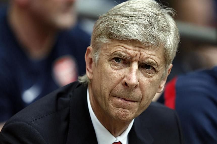 Arsenal's French manager Arsene Wenger attends the English FA Cup final match between Arsenal and Hull City at Wembly Stadium in London on May 17, 2014. -- PHOTO: AFP