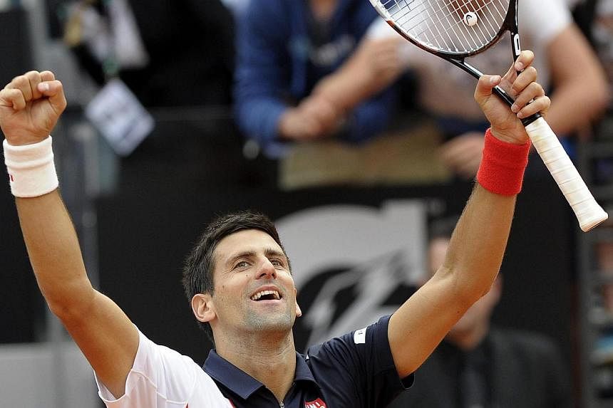 Serbian tennis player Novak Djokovic celebrates after beating Spanish tennis player Rafael Nadal in their final match of the Italian Open tennis tournament at Foro Italico in Rome, Italy, on 18 May 2014. -- PHOTO: EPA