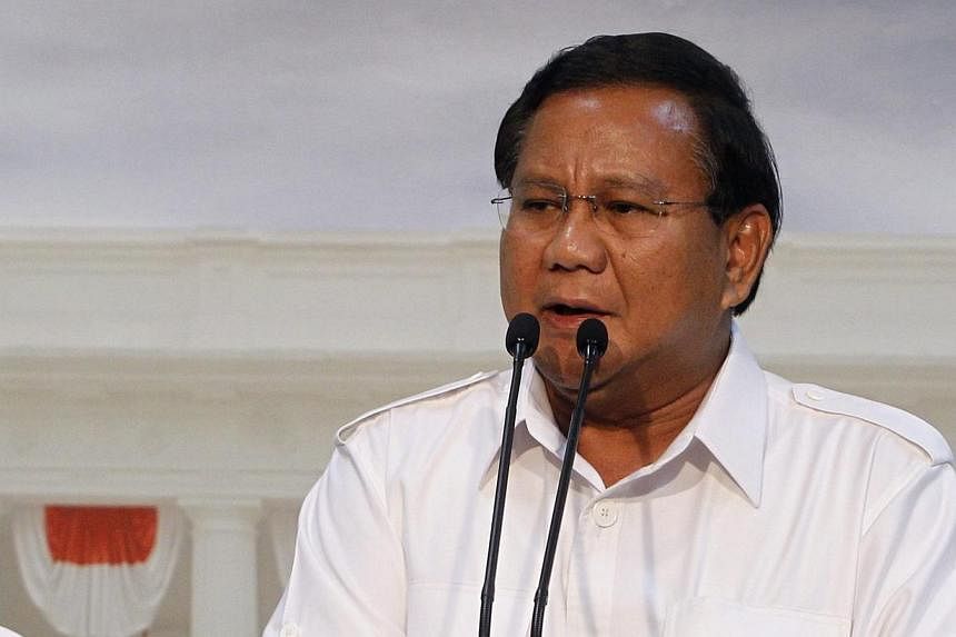 Indonesian presidential candidate and head of the Great Indonesia Movement Party (Gerindra) Prabowo Subianto talks to jornalists in Jakarta, Indonesia, on May 13, 2014. Indonesia's second largest party, Golkar, will support Mr Subianto in July's pres