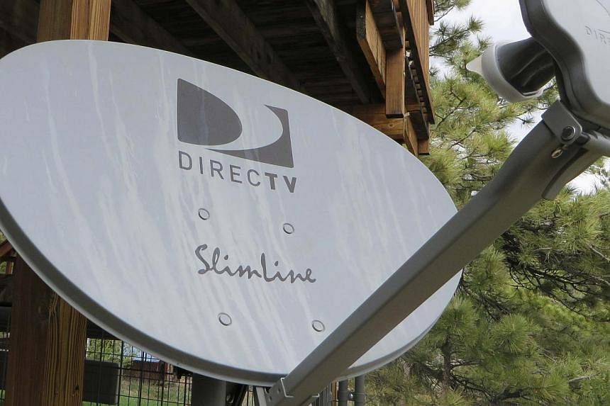 A DirecTV satellite dish is seen on a home in the mountains outside Golden, Colorado on May 18, 2014. -- PHOTO: REUTERS