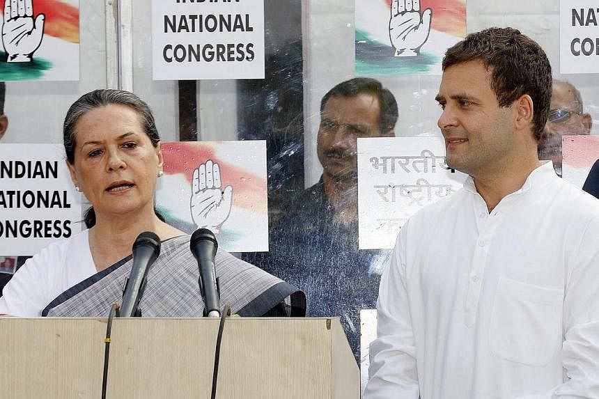 Indian National Congress (INC) president Sonia Gandhi (left) and vice-president Rahul Gandhi address the media after the India's Hindu nationalist Bharatiya Janata Party (BJP) set to sweep the Indian elections in New Delhi, India on May 16, 2014. Ind