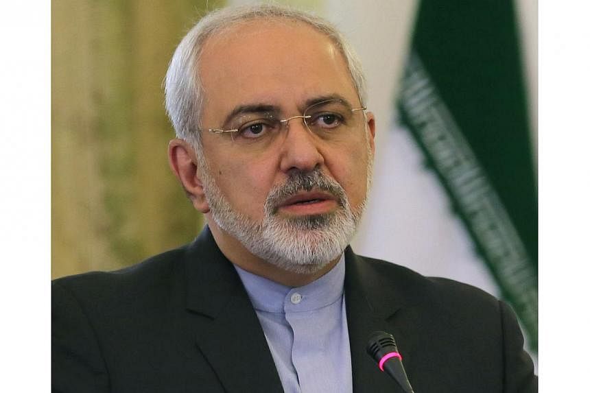 A file picture taken on April 23, 2014 shows Iranian Foreign Minister Mohammad Javad Zarif giving a press conference in Tehran. Zarif said on May 18, 2014 that clinching a final nuclear deal with world powers is still "possible" despite a tough round