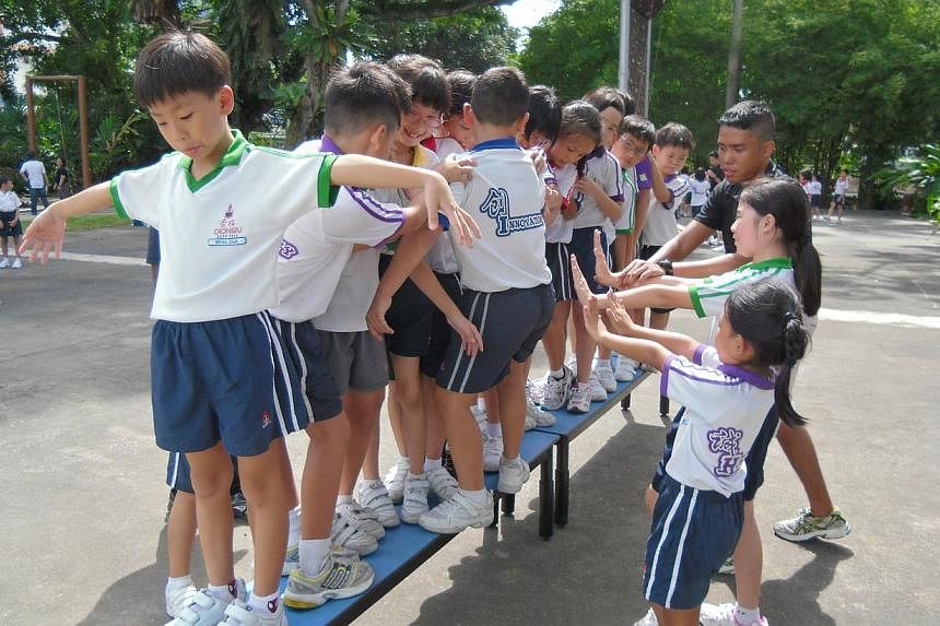 Primary 3 pupils from Chongfu School learning about teamwork through a game facilitated by an external trainer at Labrador Park last year.