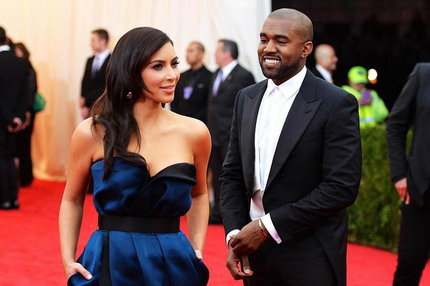 Kim Kardashian (left) and Kanye West attend the Charles James: Beyond Fashion Costume Institute Gala at the Metropolitan Museum of Art in New York City on May 5, 2014. -- FILE PHOTO: AFP&nbsp;