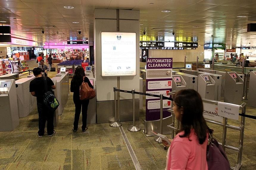 An immigration clearance checkpoint in Changi Airport. -- ST FILE PHOTO: SEAH KWANG PENG