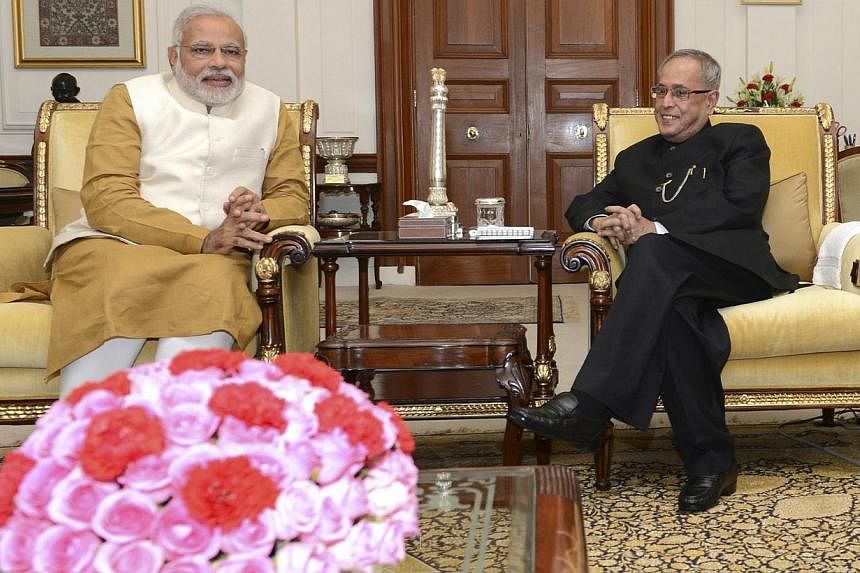Hindu nationalist Narendra Modi (left), who will be the next prime minister of India, and India's President Pranab Mukherjee meet at India's presidential palace Rashtrapati Bhavan in New Delhi on May 20, 2014. -- PHOTO: REUTERS&nbsp;