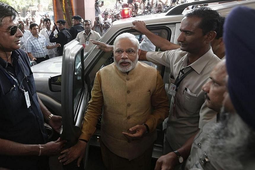 Hindu nationalist Narendra Modi, the prime ministerial candidate for India's Bharatiya Janata Party (BJP), arrives to attend the BJP parliamentary party meeting at parliament house in New Delhi on May 20, 2014.&nbsp;India's Prime Minister-elect Naren