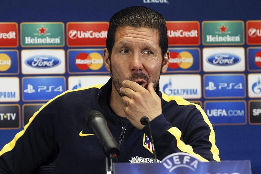 Atletico Madrid's Argentinian head coach Diego Simeone attends a press conference at the Vicente Calderon stadium in Madrid, Spain, May 19, 2014. -- PHOTO: EPA
