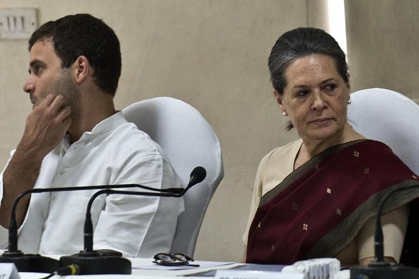 Congress party President Sonia Gandhi (right) and Vice-President Rahul Gandhi attend the Congress Working Committee (CWC) meeting in New Delhi on May 19, 2014. Sonia and Rahul Gandhi, leaders of India's defeated Congress party, offered to resign afte
