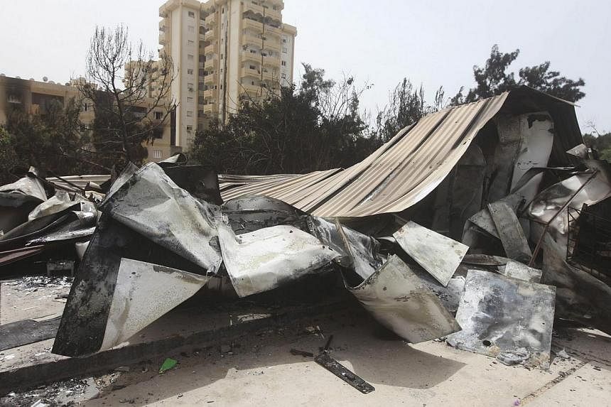 A view of damage caused by Sunday's clashes in Tripoli on May 19, 2014. Washington is closely monitoring an upsurge of violence in Libya, but has not decided yet whether to order the closure of its embassy in Tripoli, a US official said on Monday. --