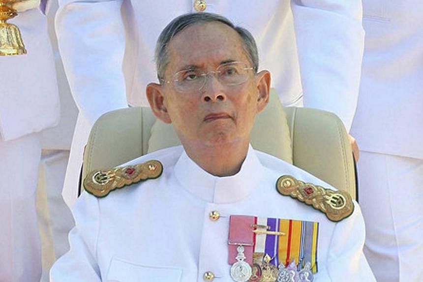Thai King Bhumibol Adulyadej sits in a wheelchair during the 64th anniversary of Coronation Day at the Klai Kangwon Palace in Hua Hin, south-west of Bangkok, Thailand, on May 5, 2014. -- FILE PHOTO: EPA