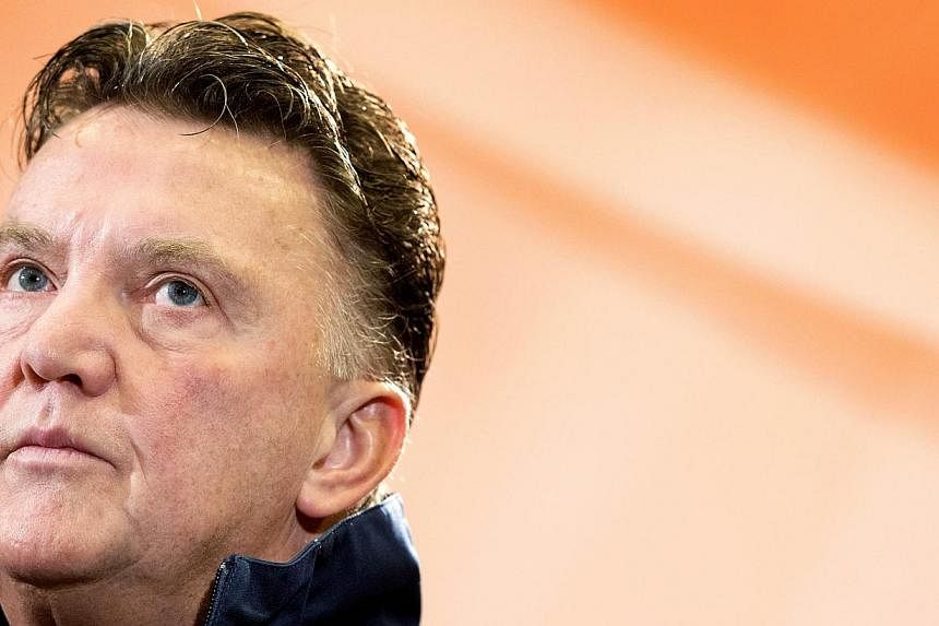 Dutch national football team's coach Louis van Gaal attends a press conference in Noordwijk, on the eve of the Netherlands' international football match against Colombia on Nov 18, 2013. Louis van Gaal promised to make history and return Manchester U