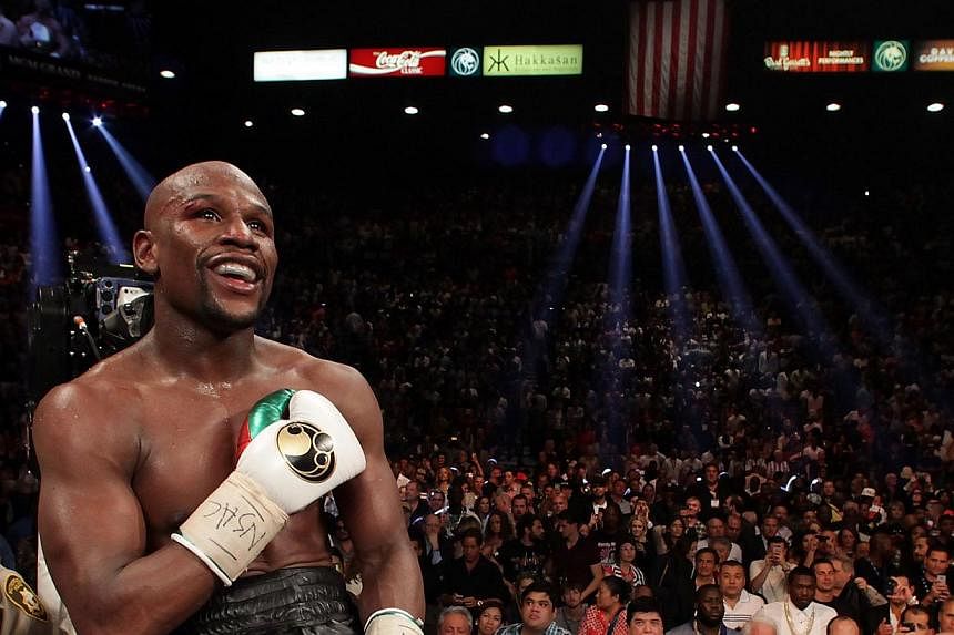 Floyd Mayweather Jr of the US celebrates his win over Marcos Maidana of Argentina on May 3, 2014 at The MGM Grand, Las Vegas. &nbsp;-- FILE PHOTO : AFP