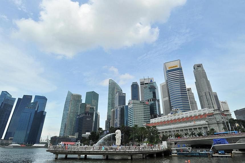 Singapore's economy grew 4.9 per cent in the first three months of the year over a year ago, lower than the 5.1 per cent previously estimated, the Ministry of Trade and Industry (MTI) said on Tuesday, May 20, 2014. -- ST FILE PHOTO: LIM YAOHUI &nbsp;