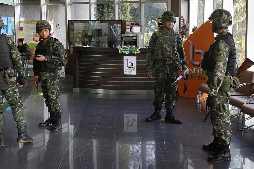 Thai soldiers occupy the foyer of the National Broadcasting Services of Thailand television station in Bangkok on May 20, 2014. -- PHOTO: REUTERS