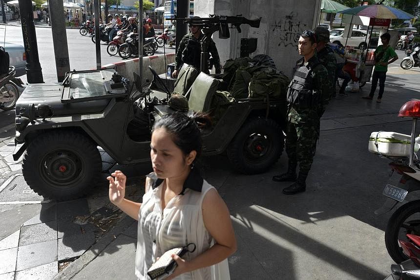 Thai army soldiers securing Ratchaprasong intersection in Bangkok on May 20, 2014. -- PHOTO: &nbsp;AFP