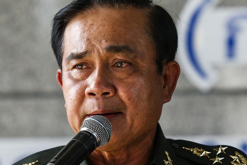 Thai Army chief General Prayuth Chan-ocha speaks during a news conference at The Army Club after the army declared martial law nationwide to restore order, in Bangkok on May 20, 2014. -- PHOTO: REUTERS