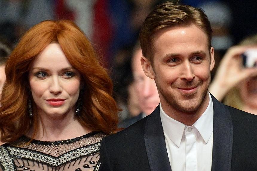 Canadian actor Ryan Gosling (R) and US actress Christina Hendricks arrive for the screening of the film Lost River at the 67th edition of the Cannes Film Festival in Cannes, southern France, on May 20, 2014. -- PHOTO: AFP