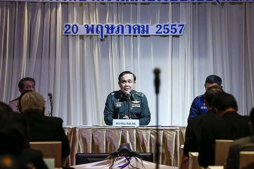 Thai Army chief General Prayuth Chan-ocha speaks during meeting with high ranking officials at The Army Club after the army declared martial law nationwide to restore order, in Bangkok. -- PHOTO: REUTERS