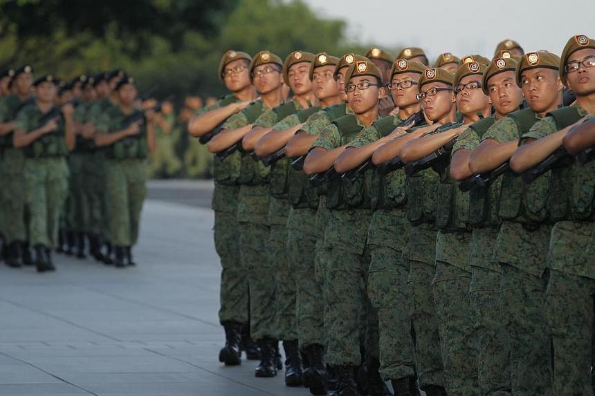 Members of the Singapore Armed Forces during the march pass at the SAF Day Parade held at Safti Military Institute on July 1, 2013. -- PHOTO: ST FILE