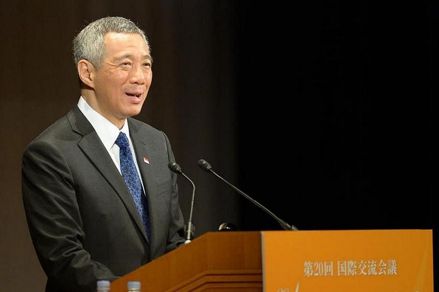 Singapore Prime Minister Lee Hsien Loong&nbsp;delivers his keynote address during the 20th Nikkei Conference&nbsp;in Tokyo, Japan on Thursday, May 22, 2014.&nbsp;Japan must remain a part of the Trans-Pacific Partnership (TPP) free trade agreement if 