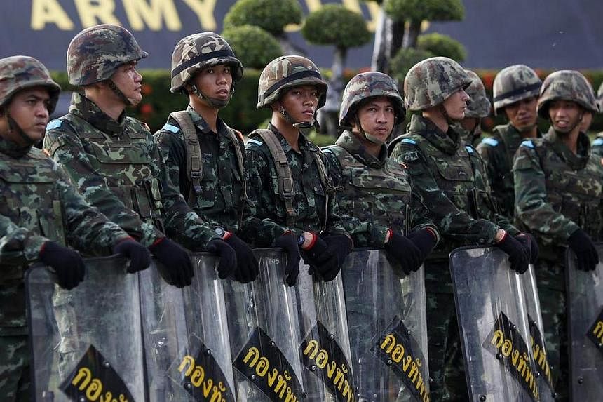 Soldiers block the access to the Army Club where Thailand's army chief held a meeting with all rival factions during a coup in central Bangkok on May 22, 2014.&nbsp;Thailand's army has banned gatherings of more than five people, a spokesman said on T