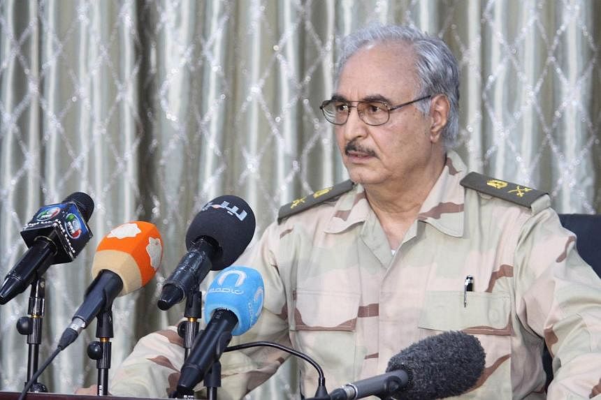 A picture made available on 20 May 2014 shows retired Libyan General Khalifa Haftar during a press conference in Abyar, a small town to the east of Benghazi, Libya, on 17 May 2014. -- EPA