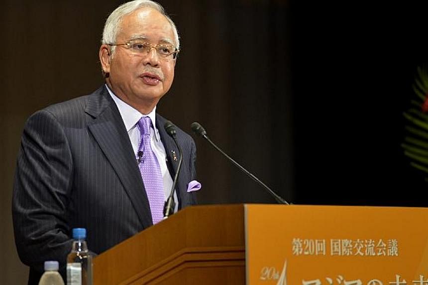 Malaysia PM Najib Razak gives his keynote speech at the 20th Nikkei Conference in&nbsp;Tokyo, Japan. -- ST PHOTO:&nbsp;JAMIE KOH