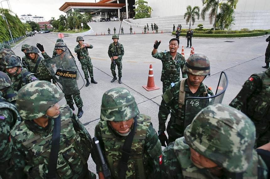 Thai soldiers take control during a coup at the Army Club where Thailand's army chief held a meeting with all rival factions in central Bangkok on Thursday, May 22, 2014. -- PHOTO: REUTERS