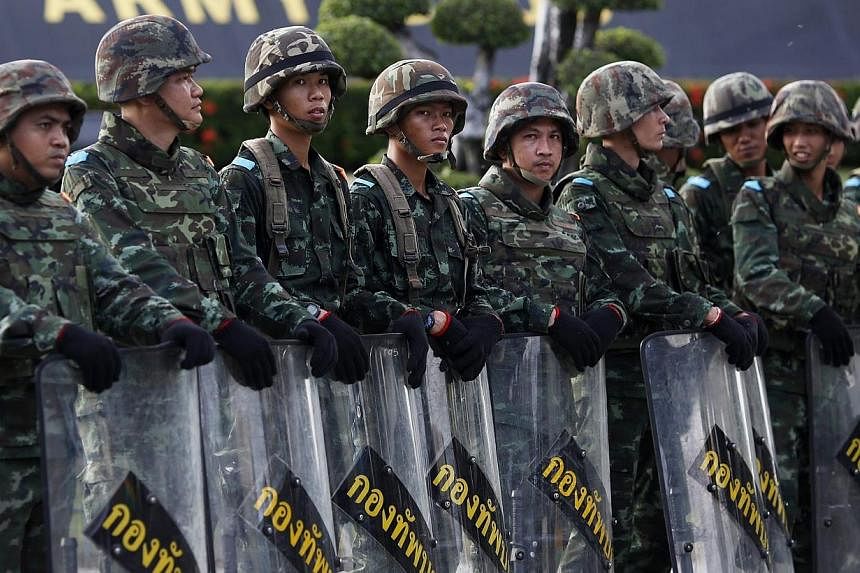 Soldiers block the access to the Army Club where Thailand's army chief held a meeting with all rival factions during a coup in central Bangkok on Thursday, May 22, 2014. -- PHOTO: REUTERS