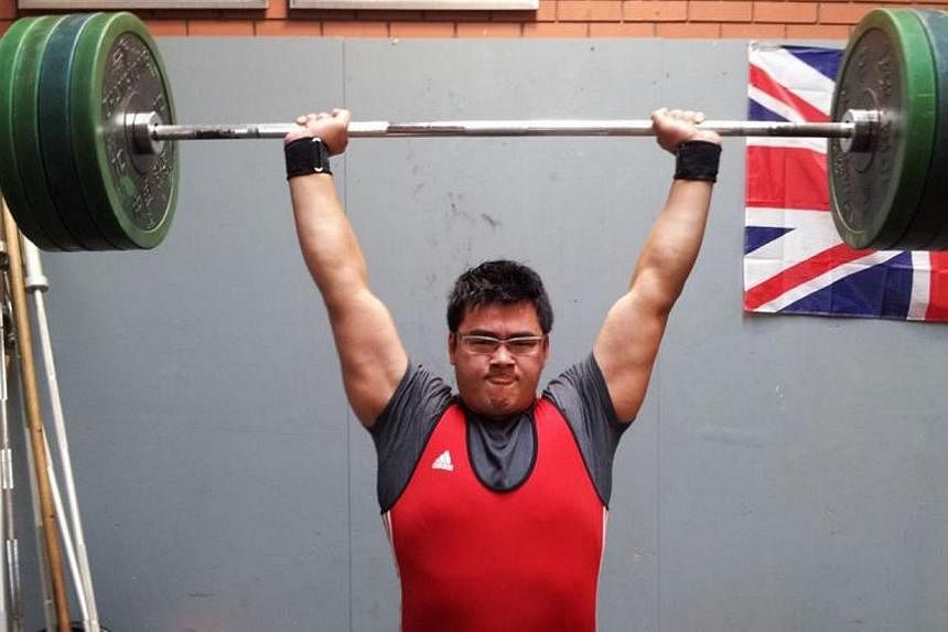 National weightlifter Scott Wong training in 2013. Wong will&nbsp;take part in the Glasgow Commonwealth Games from July 23 to Aug 3&nbsp;after the Singapore National Olympic Council approved his selection on Thursday. -- PHOTO: COURTESY OF SCOTT WONG