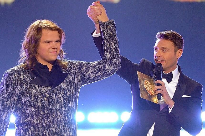Host Ryan Seacrest (right) announces Caleb Johnson as the winner onstage during Fox's American Idol XIII Finale at Nokia Theatre L.A. Live in Los Angeles, California&nbsp;on May 21, 2014. -- PHOTO: AFP