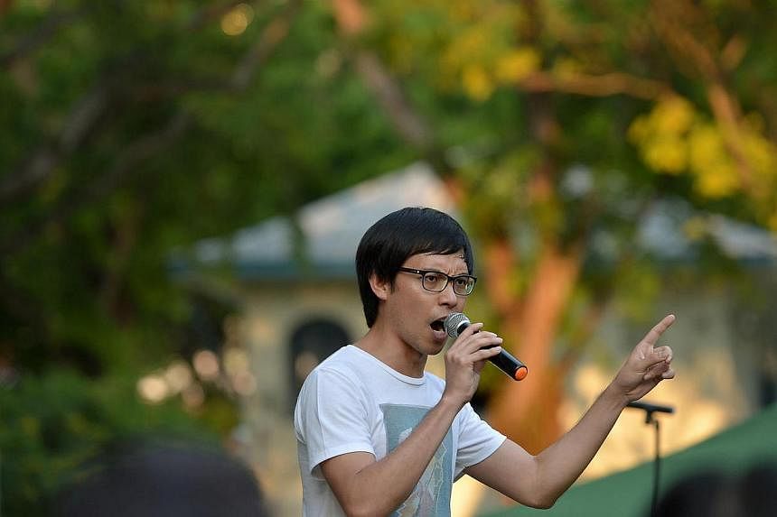 Blogger Roy Ngerng speaking at the Labour Day protest at Hong Lim Park on May 1, 2014.&nbsp;Prime Minister Lee Hsien Loong will not be dropping his demand for damages and legal costs from Mr Ngerng, his lawyer Senior Counsel Davinder Singh said in a 