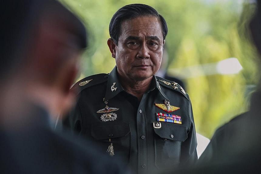 Thai Army chief General Prayuth Chan-ocha arrives before a meeting with high ranking officials at the Army Club, after the army declared martial law nationwide to restore order in Bangkok on May 20, 2014. -- PHOTO: REUTERS