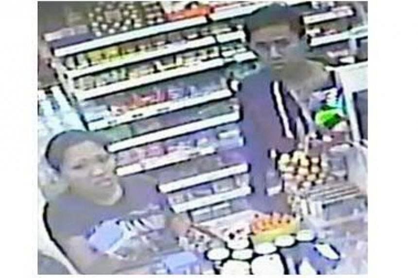 Police are looking for a man and woman to assist with investigations into a case of shop theft at a convenience store in Hougang Avenue 8 on April 28. -- PHOTO: SINGAPORE POLICE FORCE