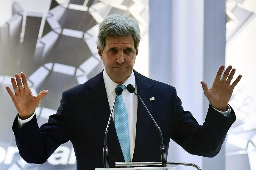 US Secretary of State John Kerry gestures during a conference in the framework of the Cleantech Challenge Mexico 2014, in Mexico City on May 21, 2014. -- PHOTO: AFP