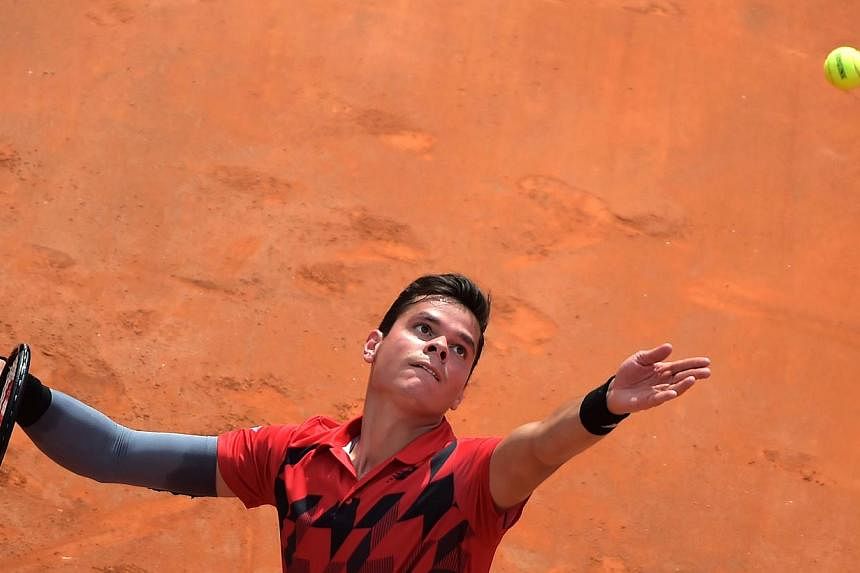 Milos Raonic of Canada serves during his ATP-WTA Rome's Tennis Masters semi-final against Novak Djokovic of Serbia at the Foro Italico in Rome&nbsp;on May 17, 2014. -- PHOTO: AFP