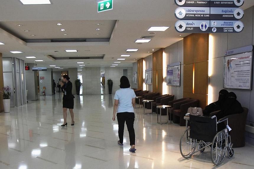 People walk inside a Bangkok hospital on May 19, 2014.&nbsp;Thailand is in danger of losing its crown as the world's top destination for medical tourism if foreigners looking for low-cost, quality healthcare are scared off by political unrest, especi