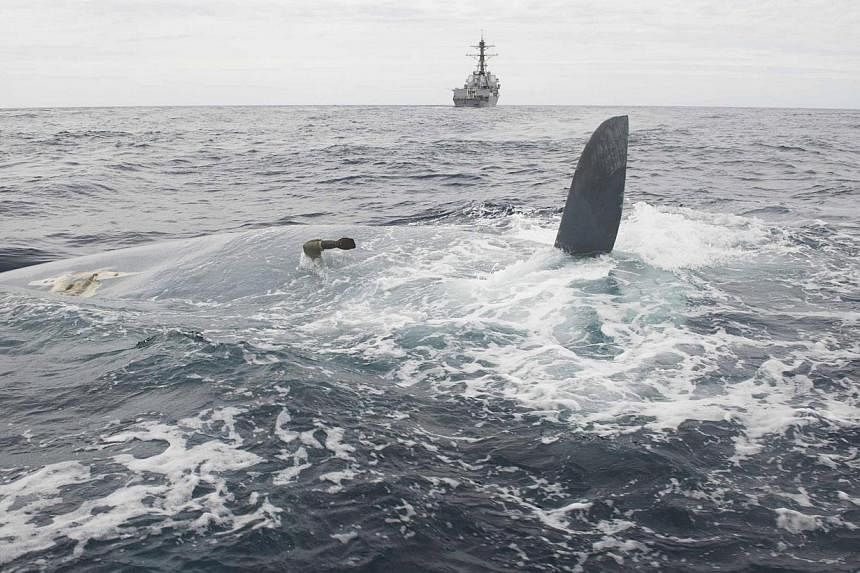 The overturned hull of the Cheeki Rafiki is shown in this May 23, 2014 handout photo, as discovered by a US Navy warship east of Cape Cod, Massachusetts. A US Navy helicopter crew on Friday spotted the British yacht that went missing a week ago but f