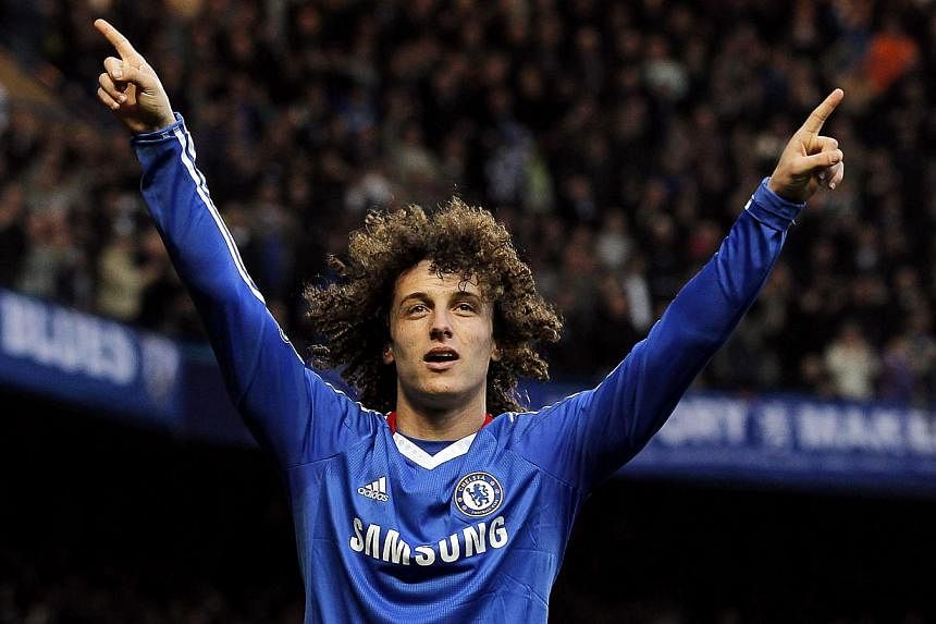 David Luiz is on the verge of joining Paris St Germain after Chelsea on Friday revealed they have agreed a deal to sell the Brazil defender to the French champions. -- PHOTO: EPA