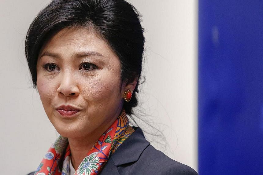 Thailand's Prime Minister Yingluck Shinawatra pauses as she addresses reporters in Bangkok on May 7, 2014. -- PHOTO: REUTERS