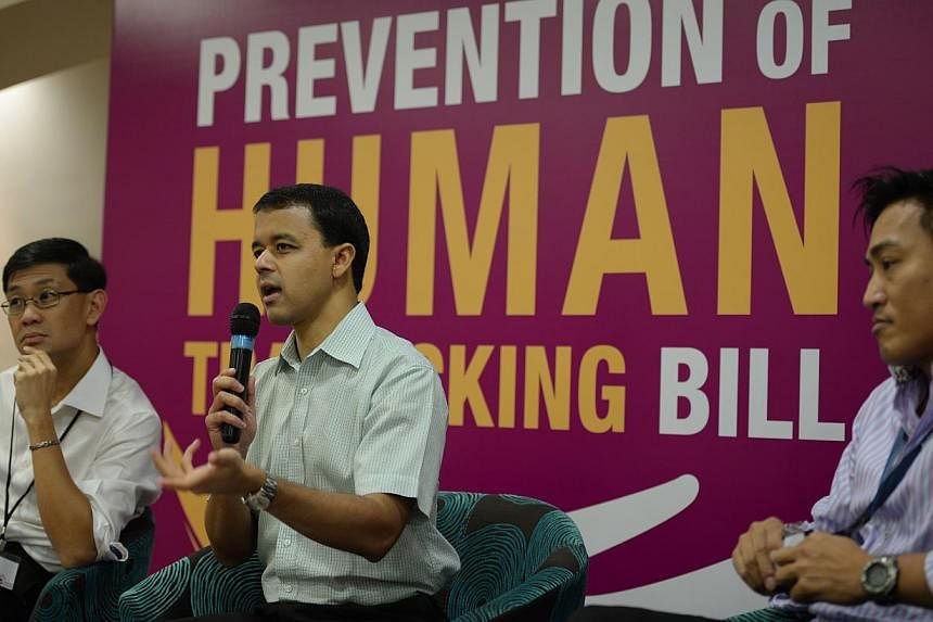 Member of Parliament Christopher de Souza (centre) speaking on March 19, 2014 at a panel discussion during a dialogue on the Bill to prevent human trafficking. More than 300 people have given their views on a proposed human trafficking law and their 