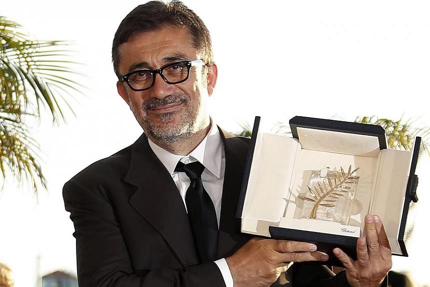 Turkish director Nuri Bilge Ceylan poses during the Award Winners photocall after he won the Palme d'Or (Golden Palm) award for his movie 'Winter Sleep' at the 67th annual Cannes Film Festival in Cannes, France, on May 24, 2014. - PHOTO: EPA