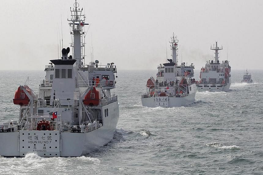 Taiwan Coast Guard patrol ships are seen during a drill held about 30 nautical miles northwest of the port of Kaohsiung, southern Taiwan, on March 30, 2013. Taiwan is building a US$100 million (S$125.3 million) port next to an airstrip on the lone is