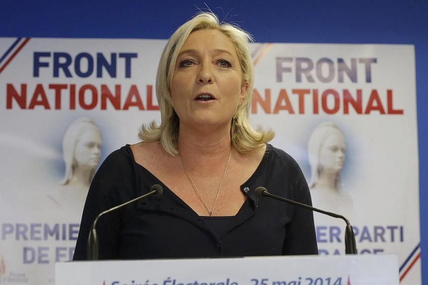 Marine Le Pen, France's National Front political party head, reacts to results after the polls closed in the European Parliament elections at the party's headquarters in Nanterre, near Paris on May 25, 2014. -- PHOTO: REUTERS