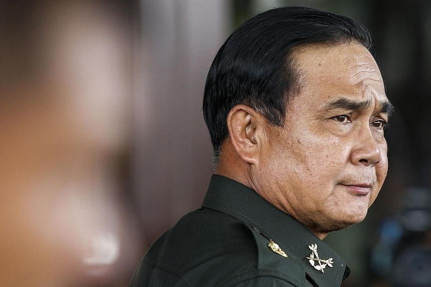 Thai Army chief General Prayuth Chan-ocha arrives before a meeting with high ranking officials at the Army Club after the army declared martial law nationwide to restore order, in Bangkok May 20, 2014. -- FILE PHOTO: REUTERS&nbsp;