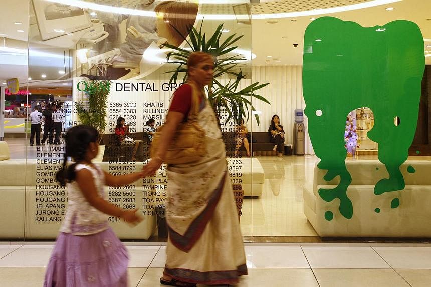 Q&amp;M dental clinic located in the City Square Mall on Dec 27, 2012. Q&amp;M Dental Group said on Monday it has formed a strategic partnership with Singapore-headquartered conglomerate IMC Group. -- FILE PHOTO: ST &nbsp;