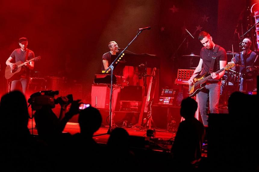 Musicians (from left) Jonny Buckland, Chris Martin, Guy Berryman, and Will Champion of Coldplay perform onstage at Royce Hall, UCLA on May 19, 2014 in Westwood, California.&nbsp;Coldplay's new album Ghost Stories went straight to number one in the ch