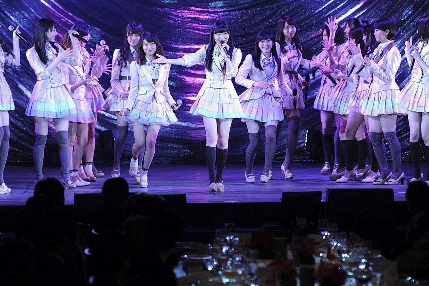 Japanese girls' pop group AKB48, led by Rino Sashihara (centre), performs on the stage during a gala dinner of the Asean-Japan Commemorative Summit meeting hosted by Japan's Shinzo Abe (not in picture), in Tokyo Dec 14, 2013 file photo. Two members o