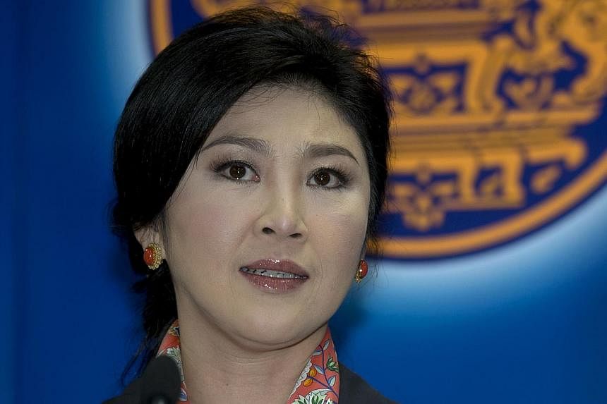 Thai Prime Minister Yingluck Shinawatra answers questions from the media during a press conference at the permanent secretary for defence suburb of Bangkok on May 7, 2014. The Thai military&nbsp;relaxed restrictions on Ms&nbsp;Yingluck, allowing her 
